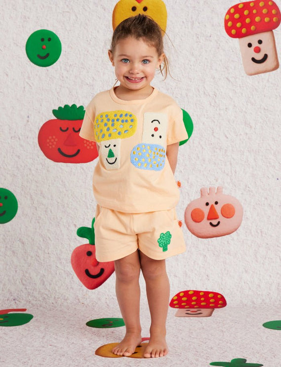 Child wearing a colorful outfit with cute design