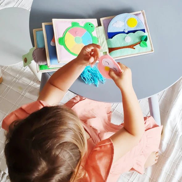 Kid interacting with Happy Panda Busy Book