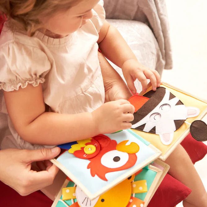 Child interacting with Leo the Lion Busy Book