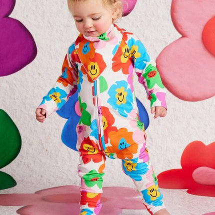 a child wearing long sleeve romper hej blomma