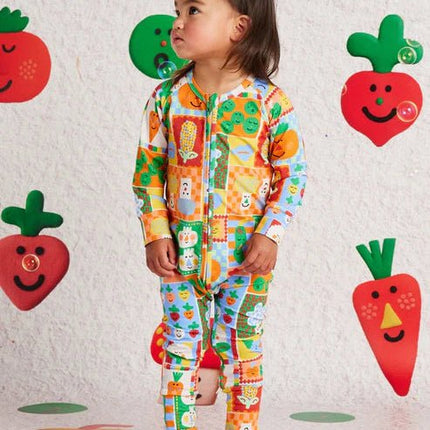 a girl wearing pocket patch longsleeve romper