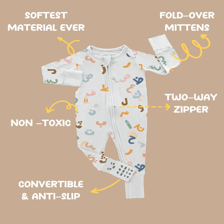Baby onesie with features highlighted on a brown background