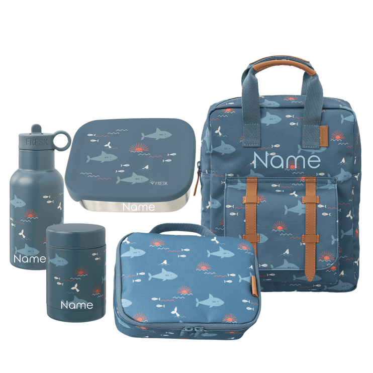 Set of blue school bags and accessories with whale pattern 