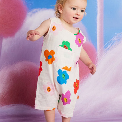 baby wearing a romper with cute colorful flower