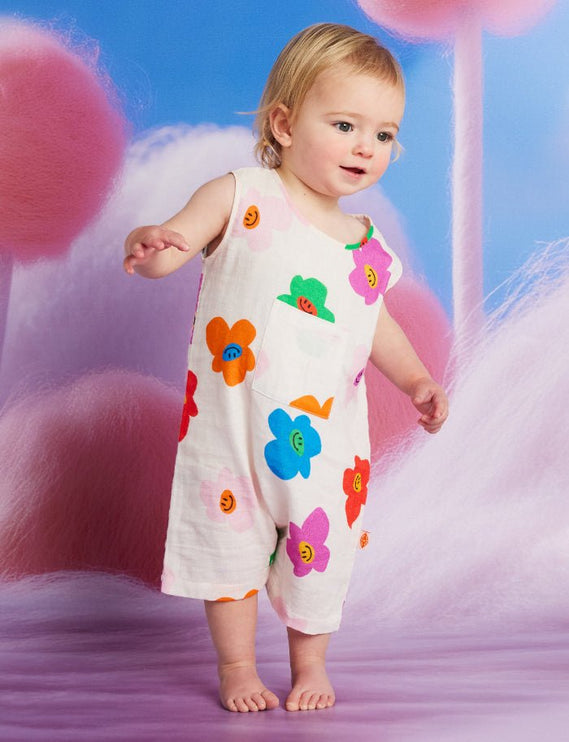 baby wearing a romper with cute colorful flower
