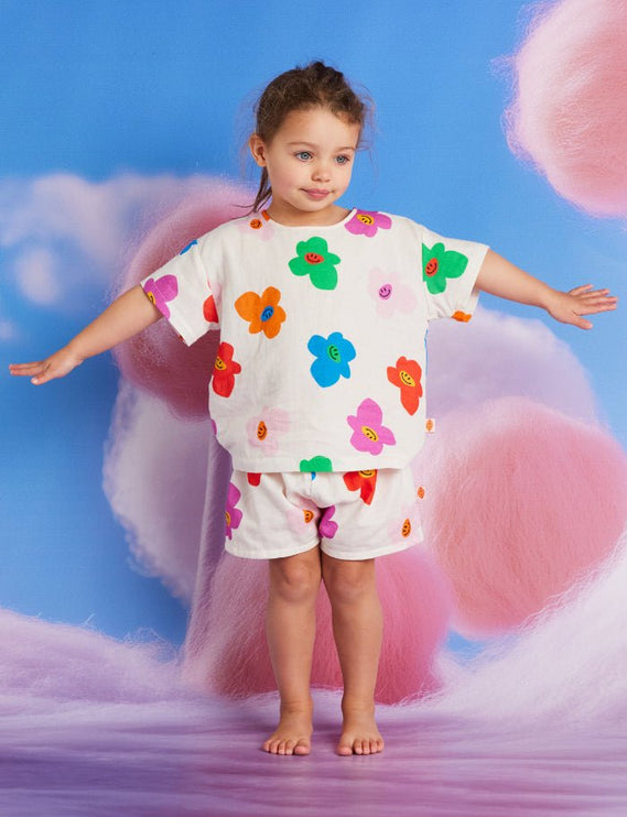 kid wearing matching shirt and short with colorful flower print